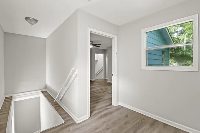 a view of an entryway with wooden floor