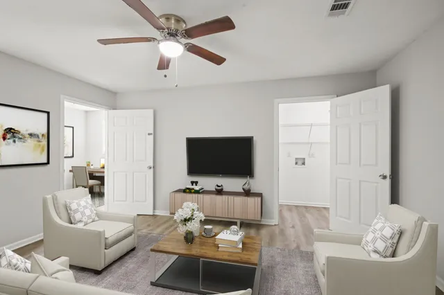 a living room with furniture and a flat screen tv