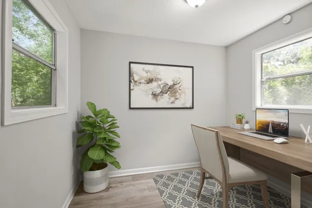 a dining room with furniture and window