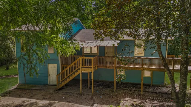 a balcony with table and chairs