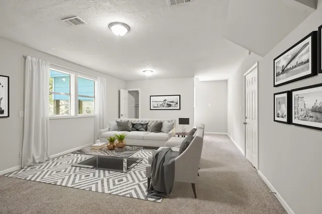 a living room with furniture and window