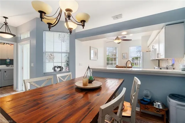 a dining room with furniture and window
