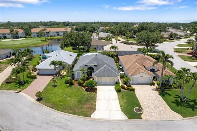 an aerial view of a house with garden space and street view
