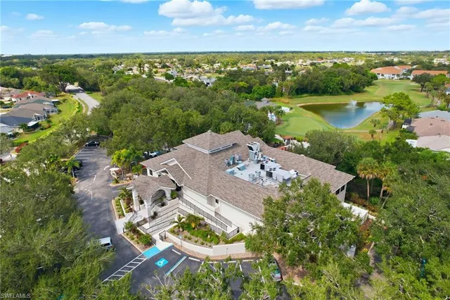an aerial view of house with yard swimming pool and outdoor seating