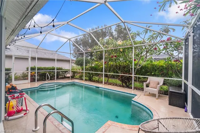 a view of a swimming pool with a patio