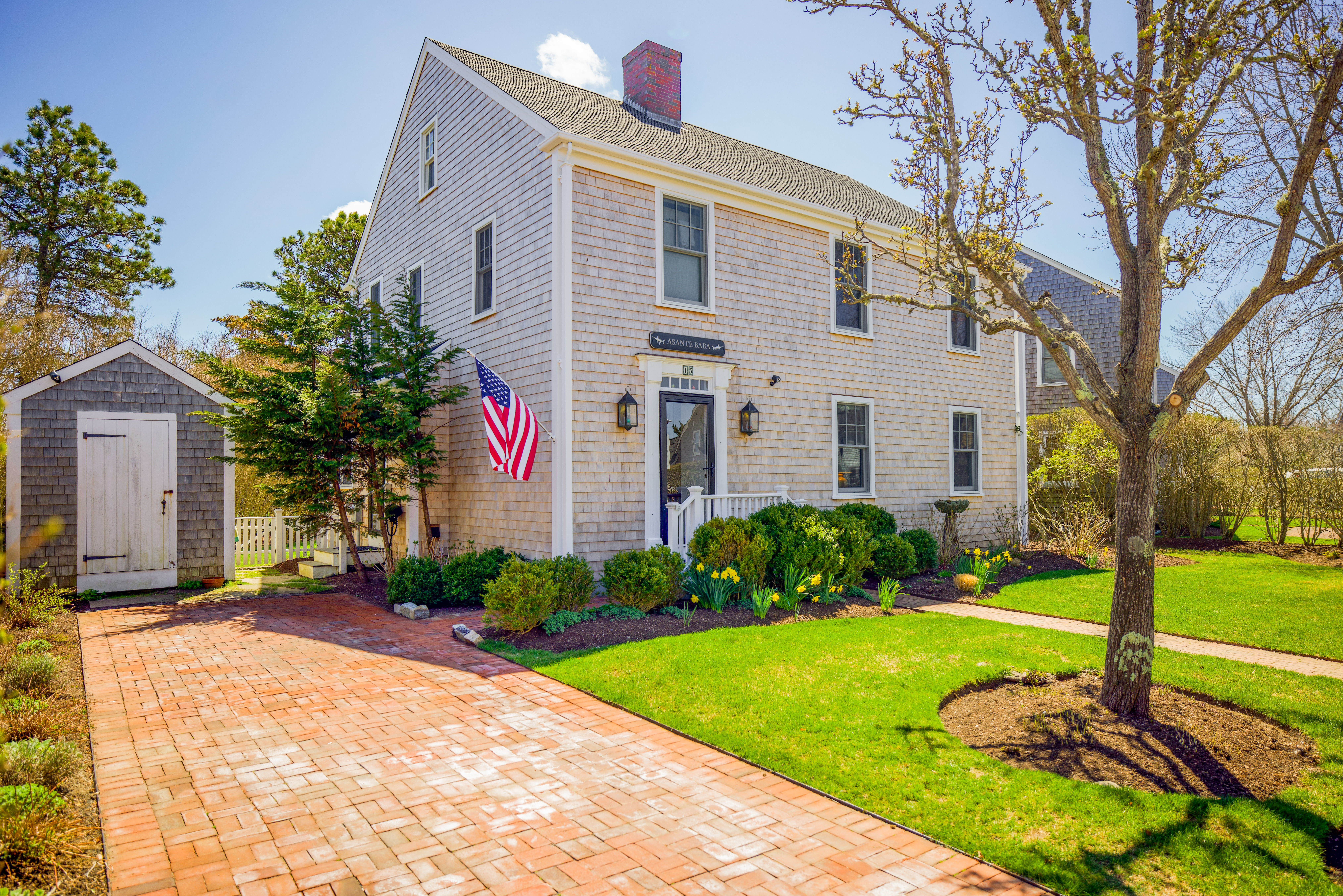 15 Goldfinch Drive Nantucket, MA 02554 - Photo 1 of 19 a front view of a house with garden