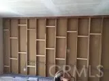 a room with lots of frames on wall
