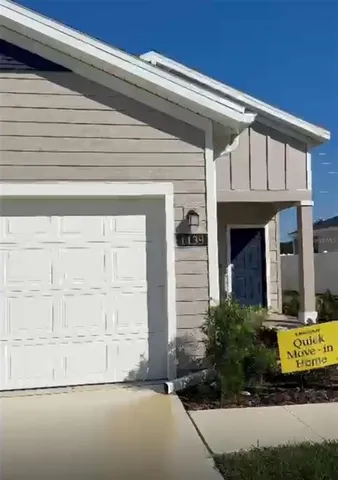 a view of a house with a small garden
