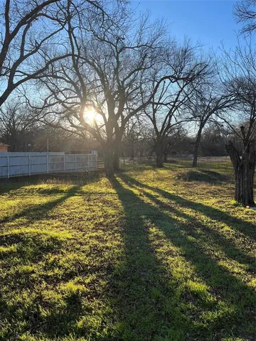 a view of a swimming pool with an outdoor space and sitting area