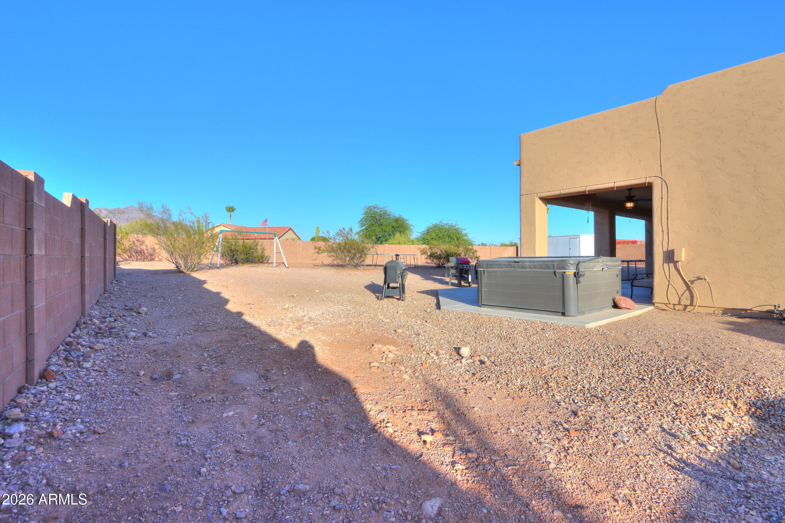 1487 South Mountain View Road Apache Junction, AZ 85119 - Photo 37 of 60 a view of a house with backyard and porch