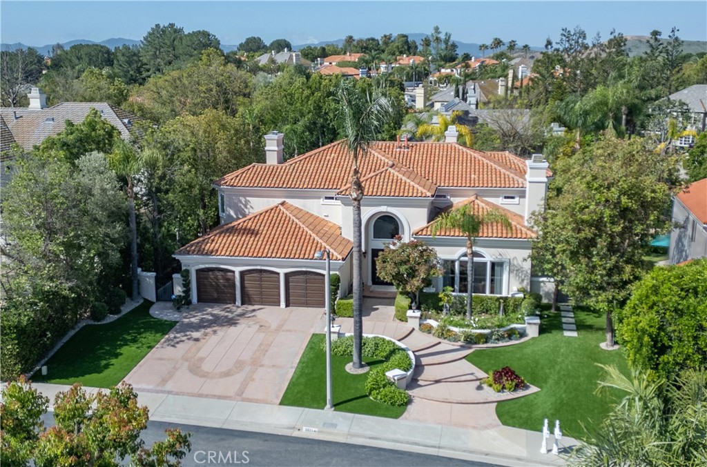 25714 Simpson Place Calabasas, CA 91302 - Photo 1 of 44 a front view of a house with garden