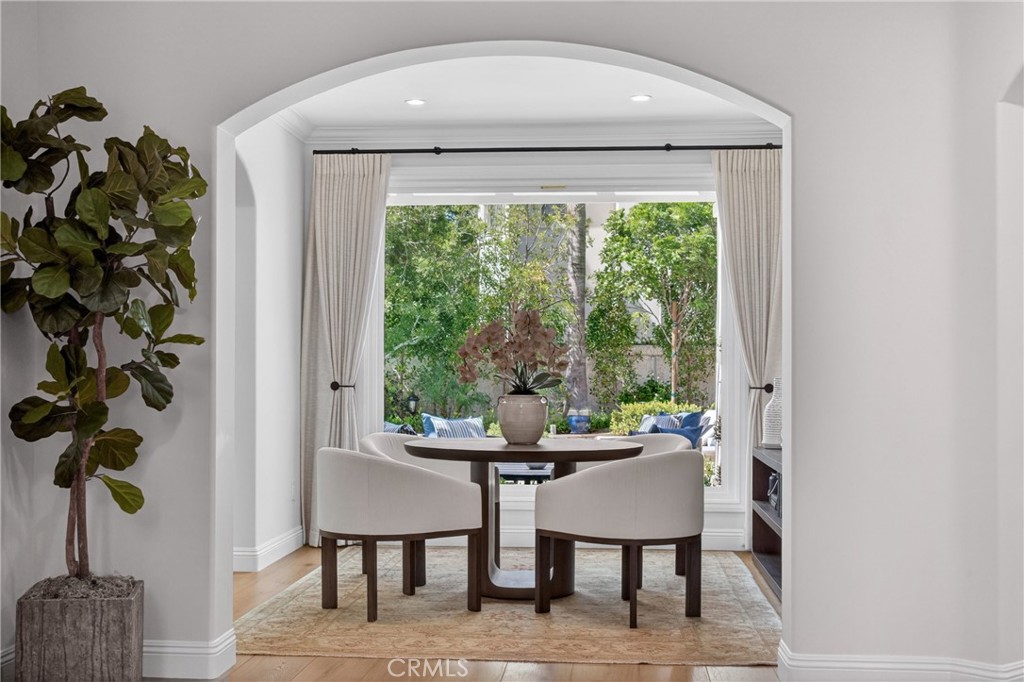 25714 Simpson Place Calabasas, CA 91302 - Photo 13 of 44 a dining room with furniture and a potted plant
