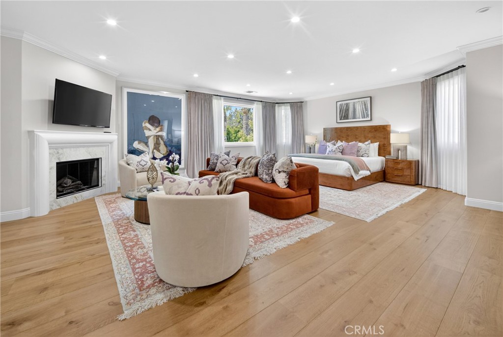25714 Simpson Place Calabasas, CA 91302 - Photo 21 of 44 a living room with fireplace furniture and a flat screen tv