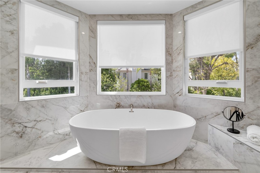25714 Simpson Place Calabasas, CA 91302 - Photo 23 of 44 a white bath tub sitting in a bathroom next to a window