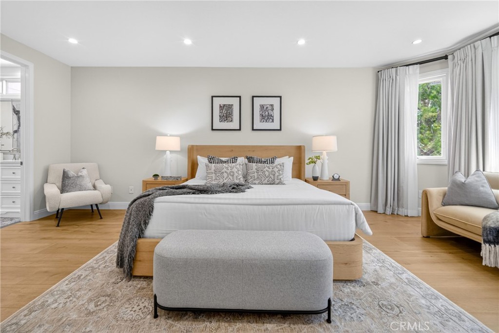 25714 Simpson Place Calabasas, CA 91302 - Photo 27 of 44 a bedroom with a bed a couch and a large window