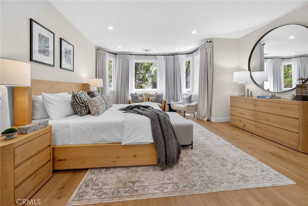 25714 Simpson Place Calabasas, CA 91302 - Photo 28 of 44 a bedroom with a large bed and a dresser