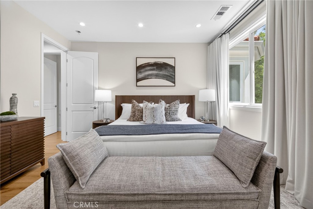 25714 Simpson Place Calabasas, CA 91302 - Photo 31 of 44 a bed room with a bed and a painting