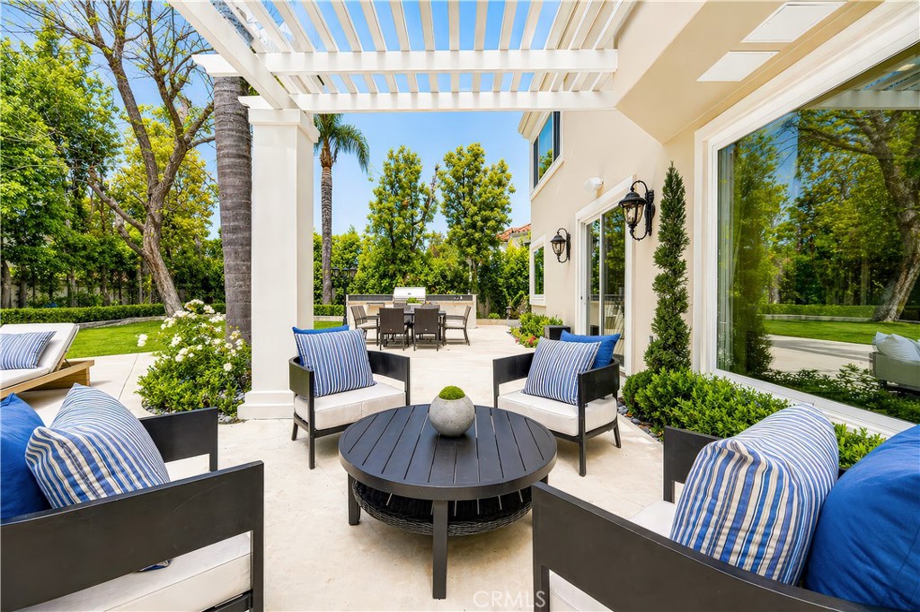 25714 Simpson Place Calabasas, CA 91302 - Photo 37 of 44 a view of a patio with couches chairs dining table and chairs
