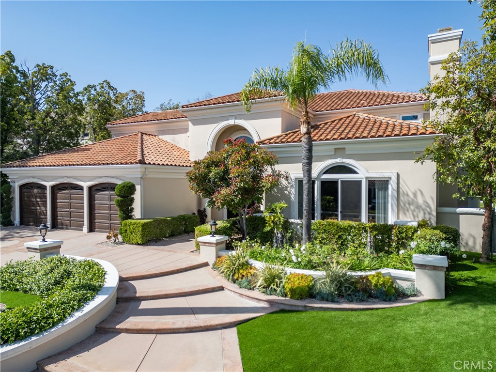 25714 Simpson Place Calabasas, CA 91302 - Photo 44 of 44 a front view of a house with a garden