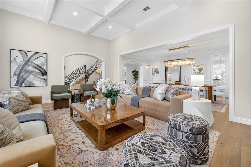 25714 Simpson Place Calabasas, CA 91302 - Photo 5 of 44 a living room with furniture potted plant and a mirror