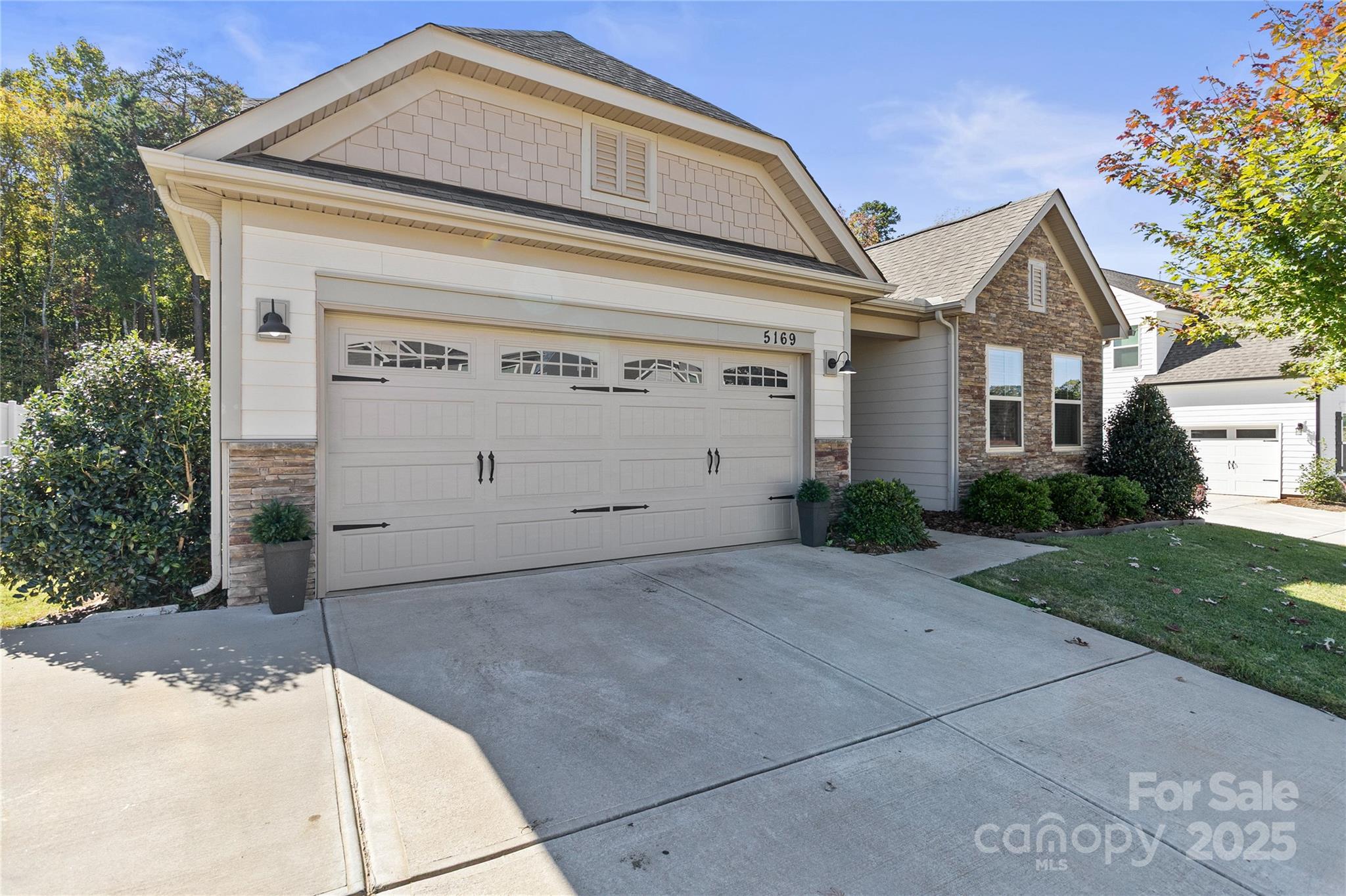 a front view of a house with garage
