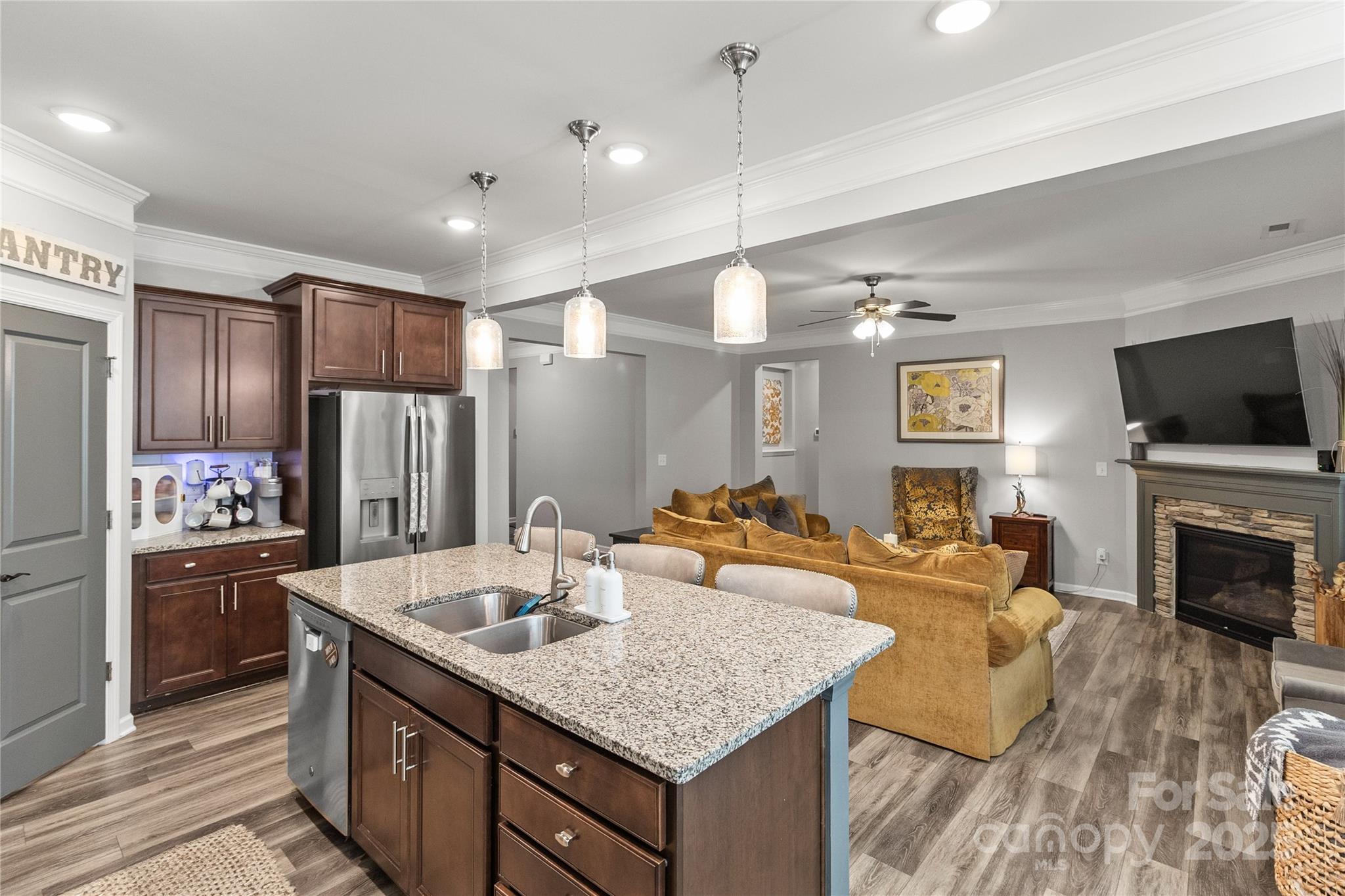 5169 Devonshire Road Denver, NC 28037 - Photo 11 of 46 a kitchen with sink refrigerator and stove
