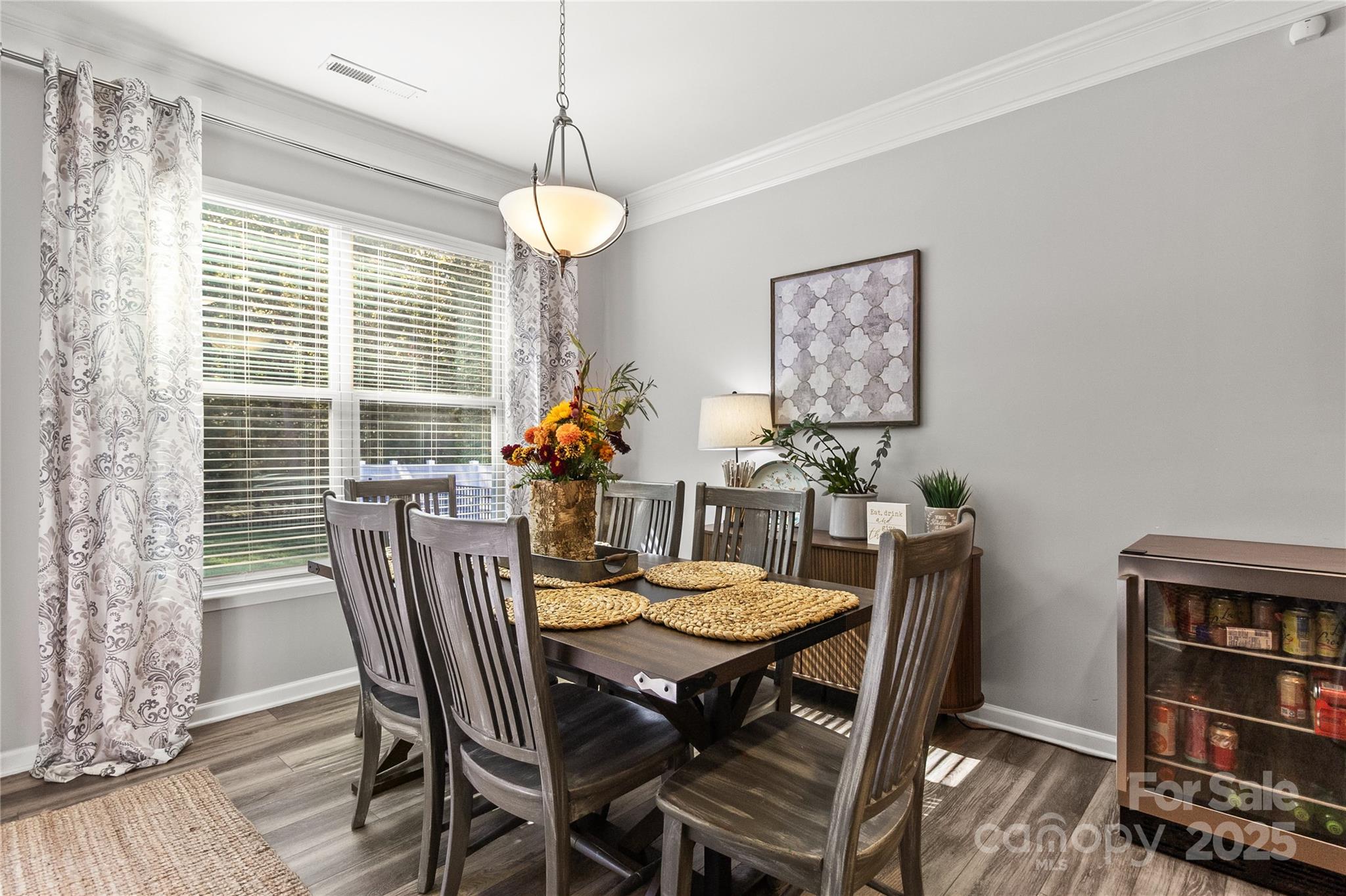 5169 Devonshire Road Denver, NC 28037 - Photo 12 of 46 a view of a dining room with furniture and a book shelf