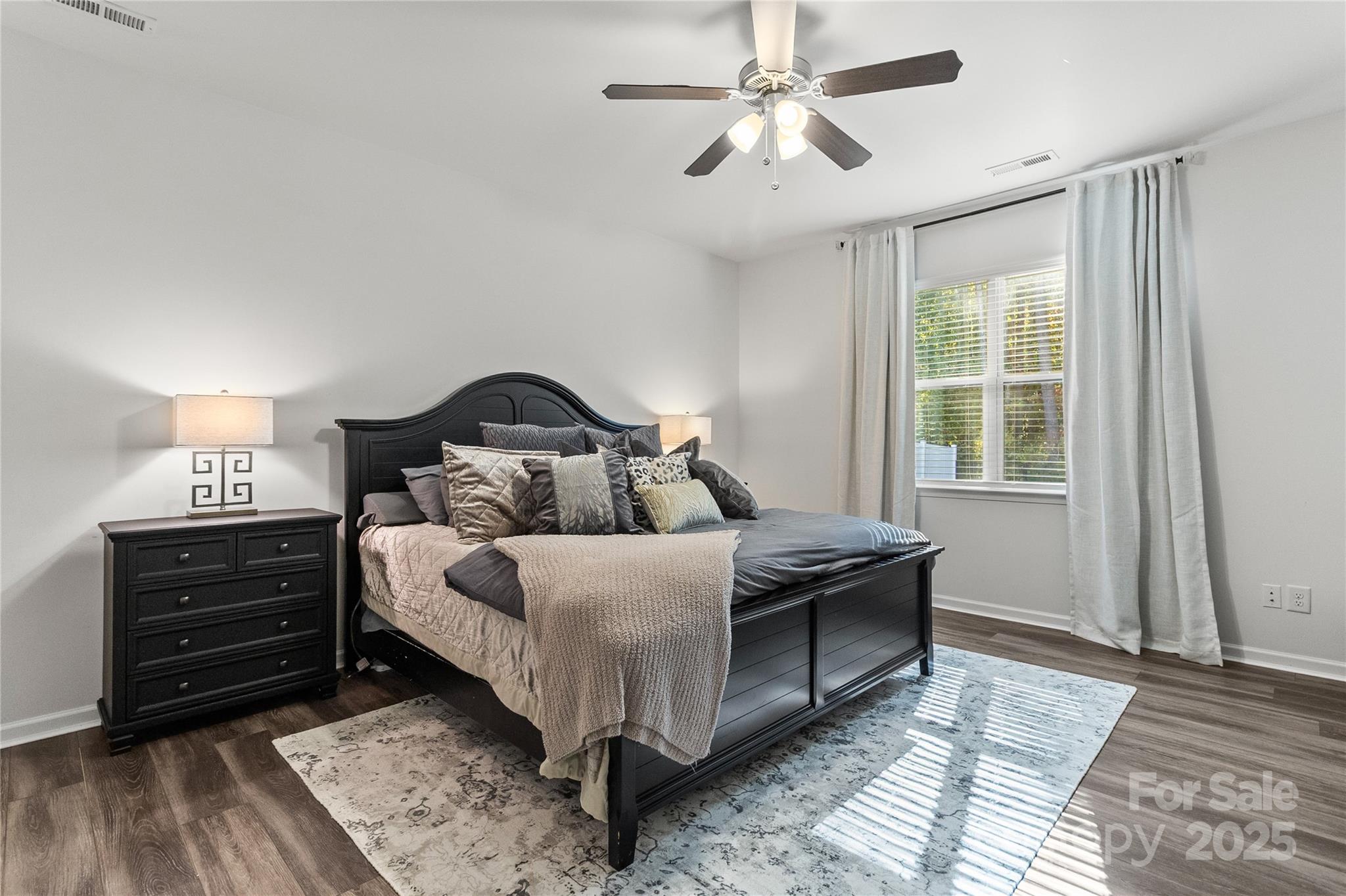 5169 Devonshire Road Denver, NC 28037 - Photo 17 of 46 a bedroom with a bed and wooden floor