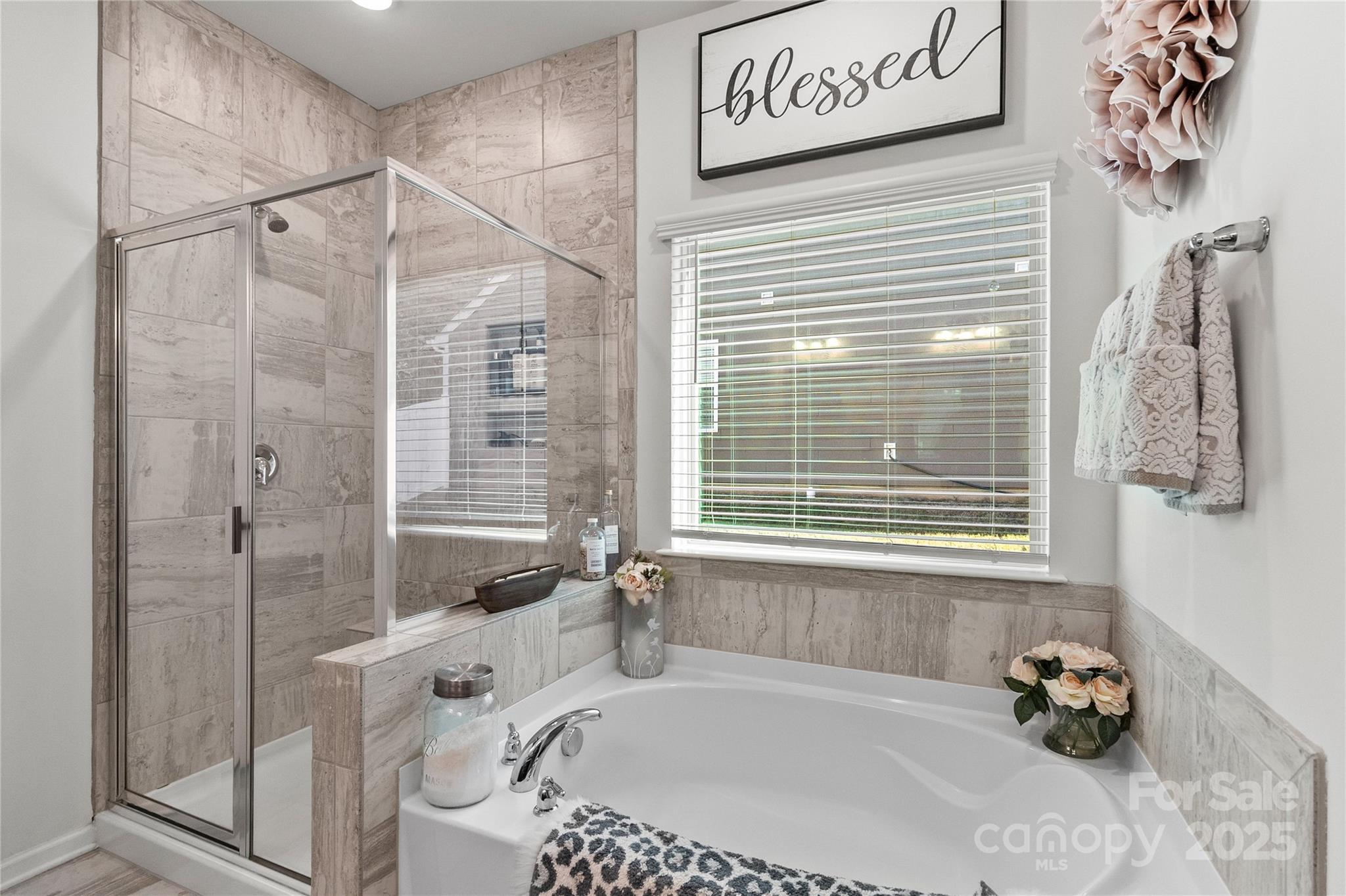 5169 Devonshire Road Denver, NC 28037 - Photo 23 of 46 a bath room with a bath tub and a shower