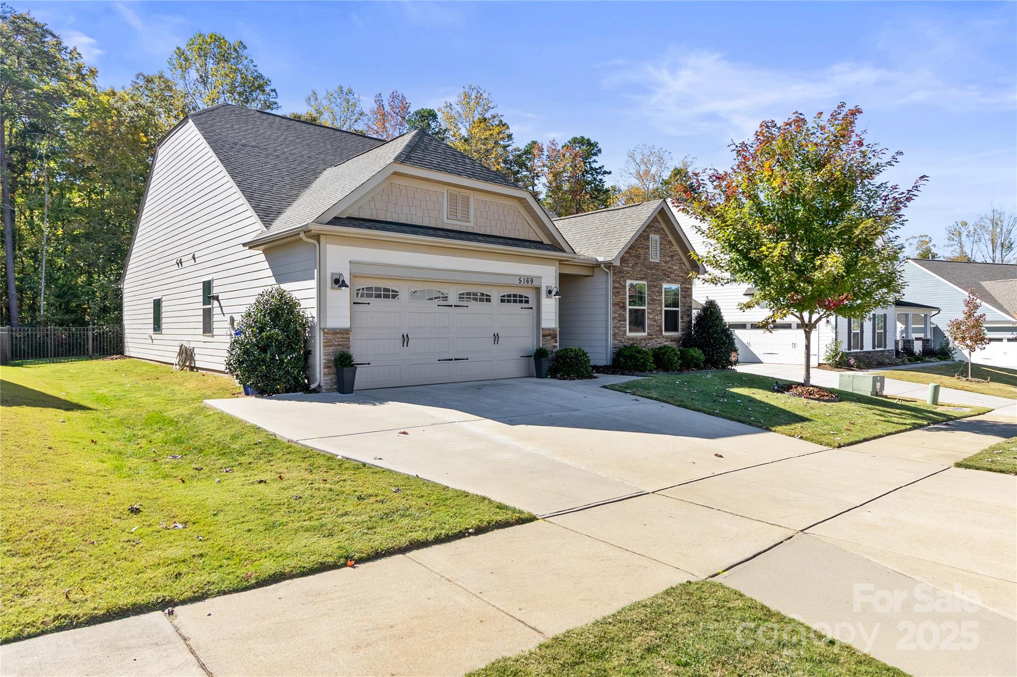 5169 Devonshire Road Denver, NC 28037 - Photo 46 of 46 a front view of a house with a yard and garage
