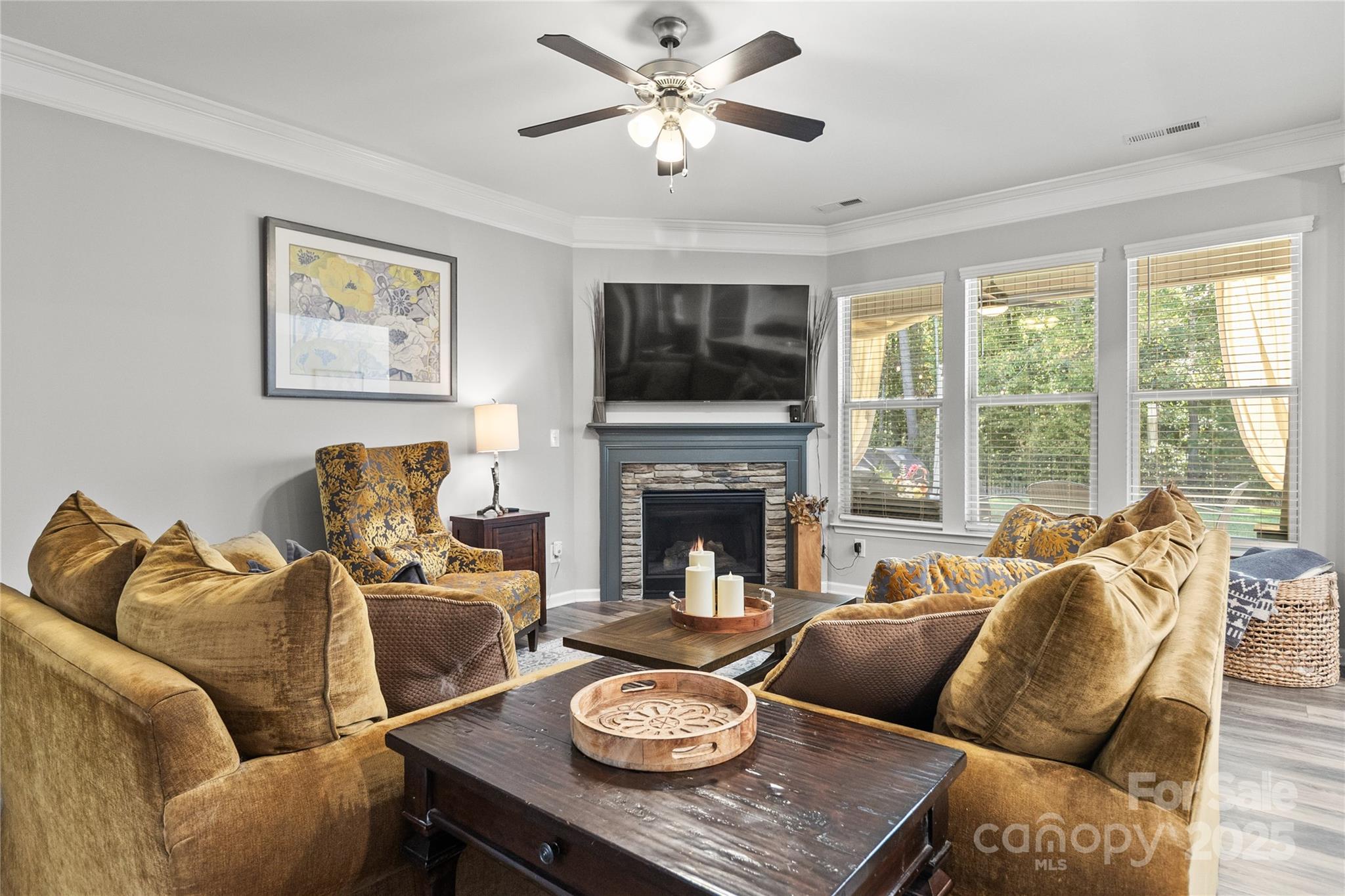 5169 Devonshire Road Denver, NC 28037 - Photo 6 of 46 a living room with furniture a flat screen tv and a large window