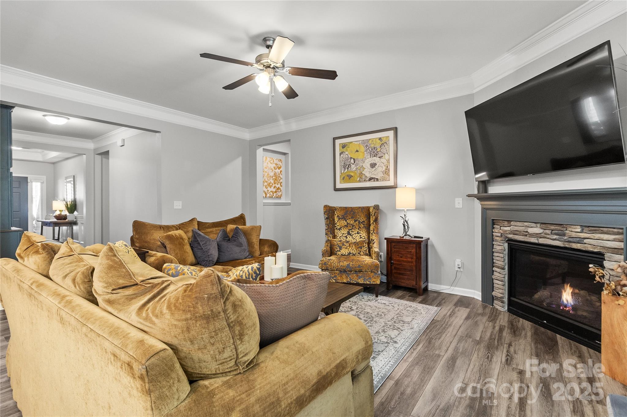 5169 Devonshire Road Denver, NC 28037 - Photo 9 of 46 a bedroom with a bed and a flat screen tv