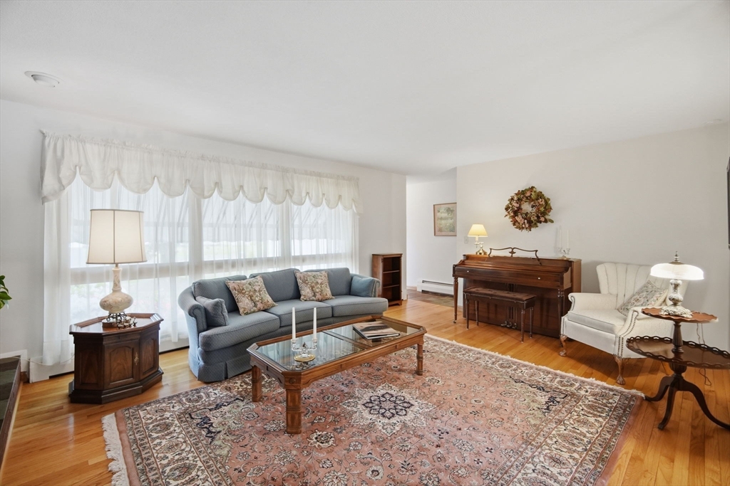 30 Birch Hill Road Northampton, MA 01062 - Photo 19 of 42 a living room with furniture a rug and a large window