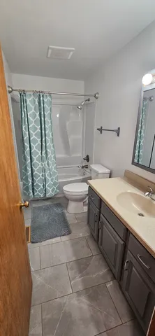 a room with a washing machine and sink