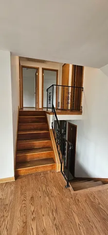 a view of entryway with wooden floor