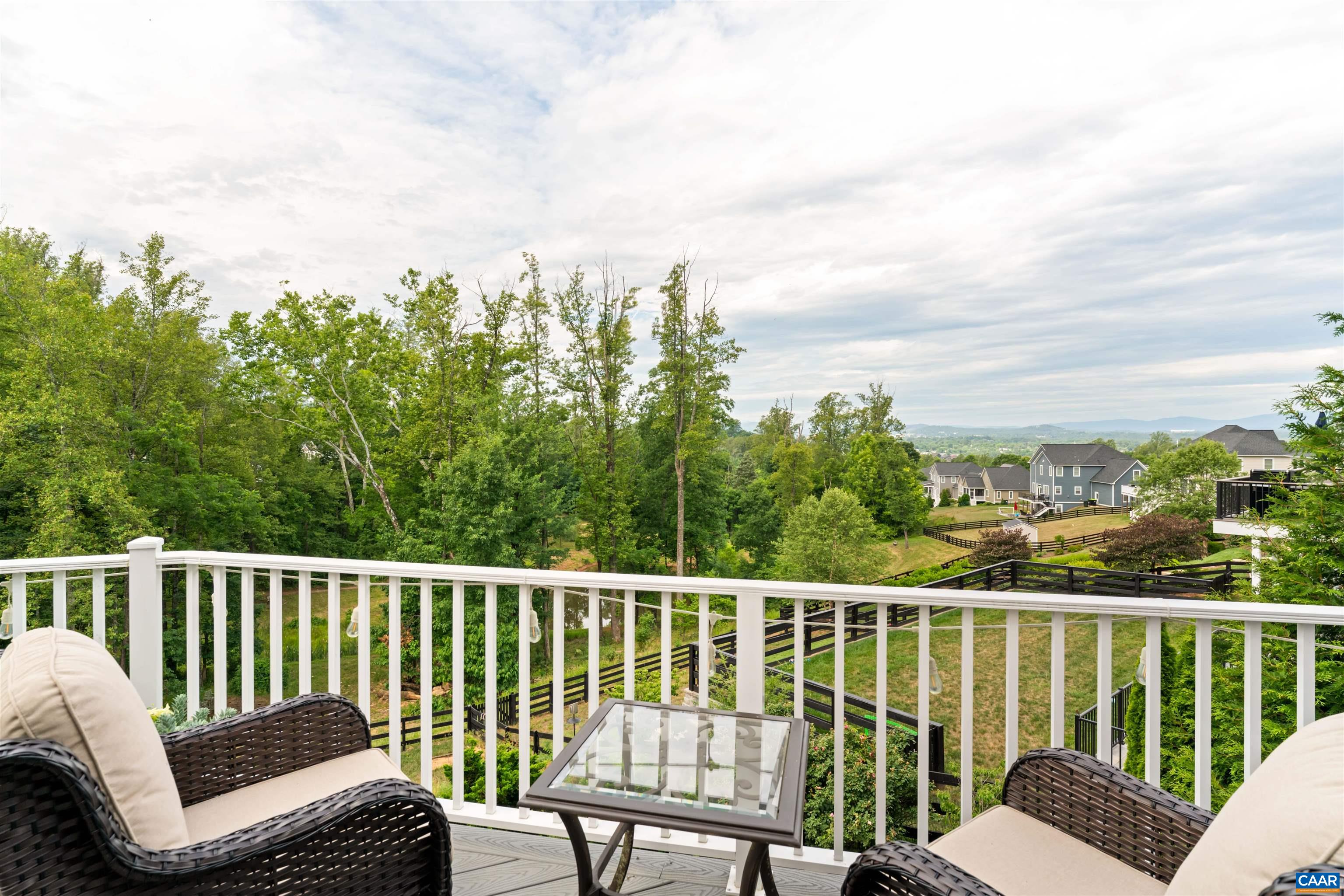 2246 Hyland Ridge Drive Charlottesville, VA 22911 - Photo 18 of 53 a view of a chair and table on the roof deck