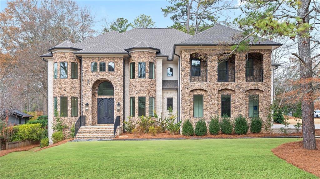 a front view of a house with a yard