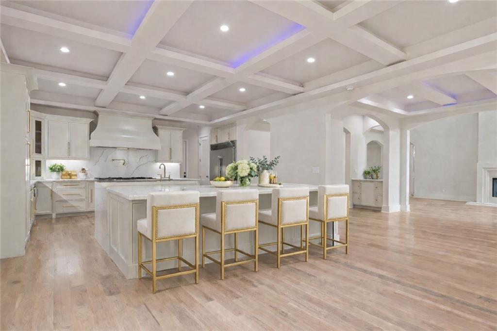 1694 Harts Mill Road Northeast Brookhaven, GA 30319 - Photo 12 of 44 a kitchen with a dining table chairs and wooden floor