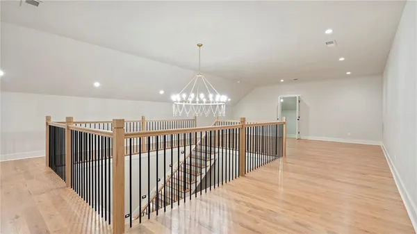 a view of a hallway with stairs