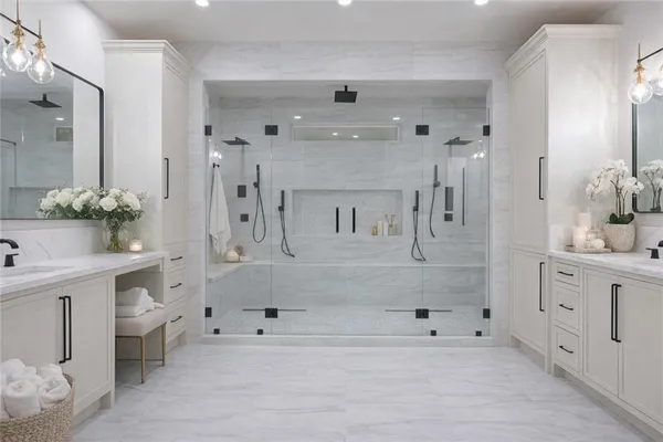 a spacious bathroom with a double vanity sink mirror and bathtub