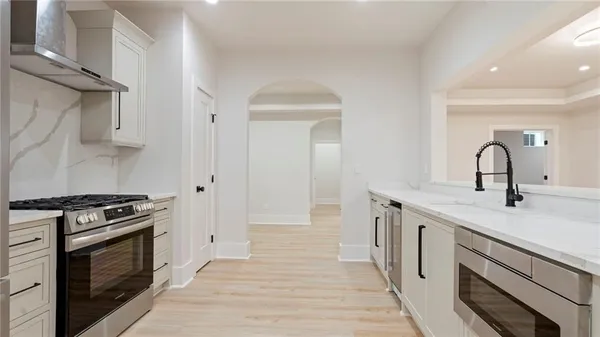 a kitchen with a stove and a sink