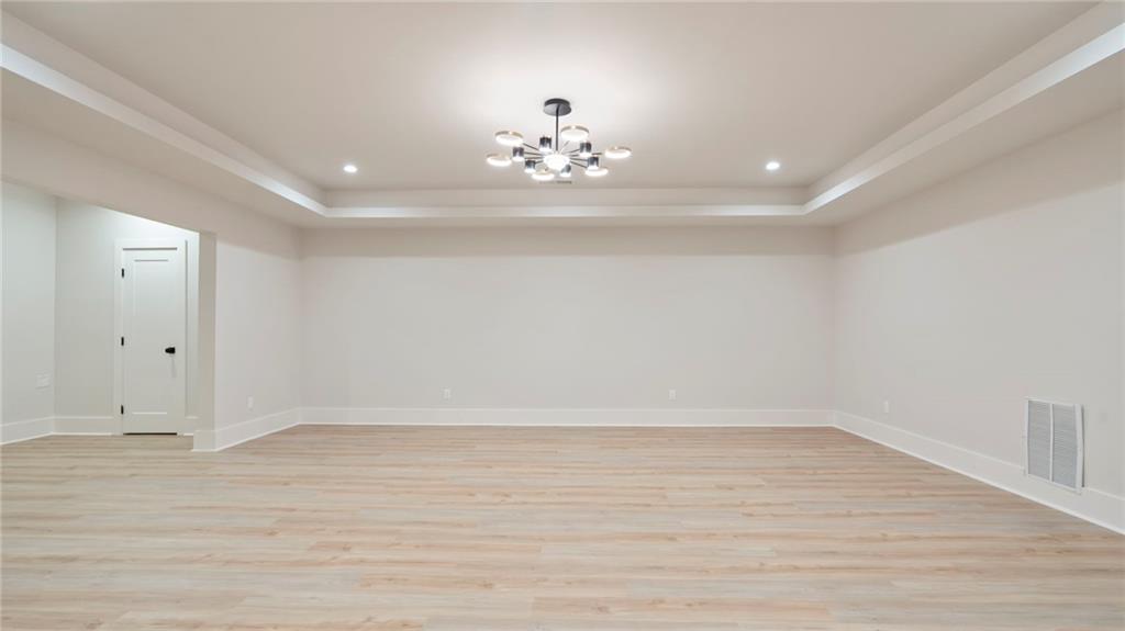 1694 Harts Mill Road Northeast Brookhaven, GA 30319 - Photo 32 of 44 wooden floor in an empty room