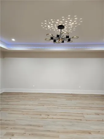 a view of a room with window and wooden floor