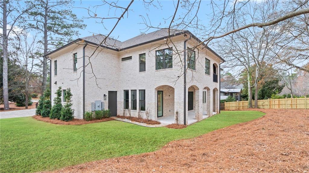 1694 Harts Mill Road Northeast Brookhaven, GA 30319 - Photo 37 of 44 a front view of a house with garden