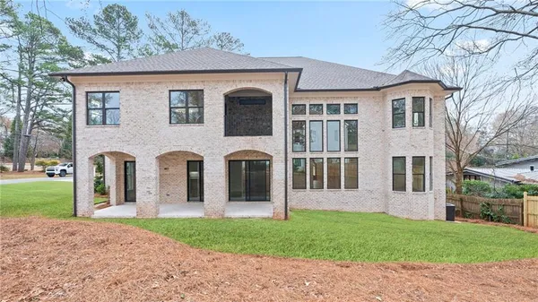 front view of a house with a yard