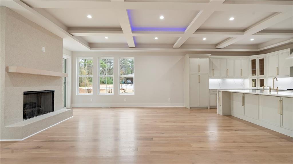 1694 Harts Mill Road Northeast Brookhaven, GA 30319 - Photo 9 of 44 a large kitchen with stainless steel appliances a large counter top a stove and a refrigerator