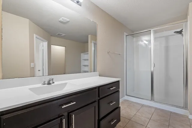 a bathroom with a sink double vanity and a mirror