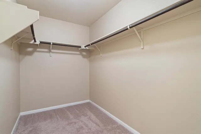 a view of an empty walk in closet