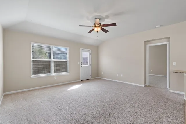 a view of empty room with windows