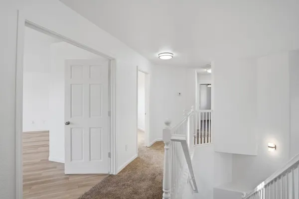 a view of a hallway with entryway and closet